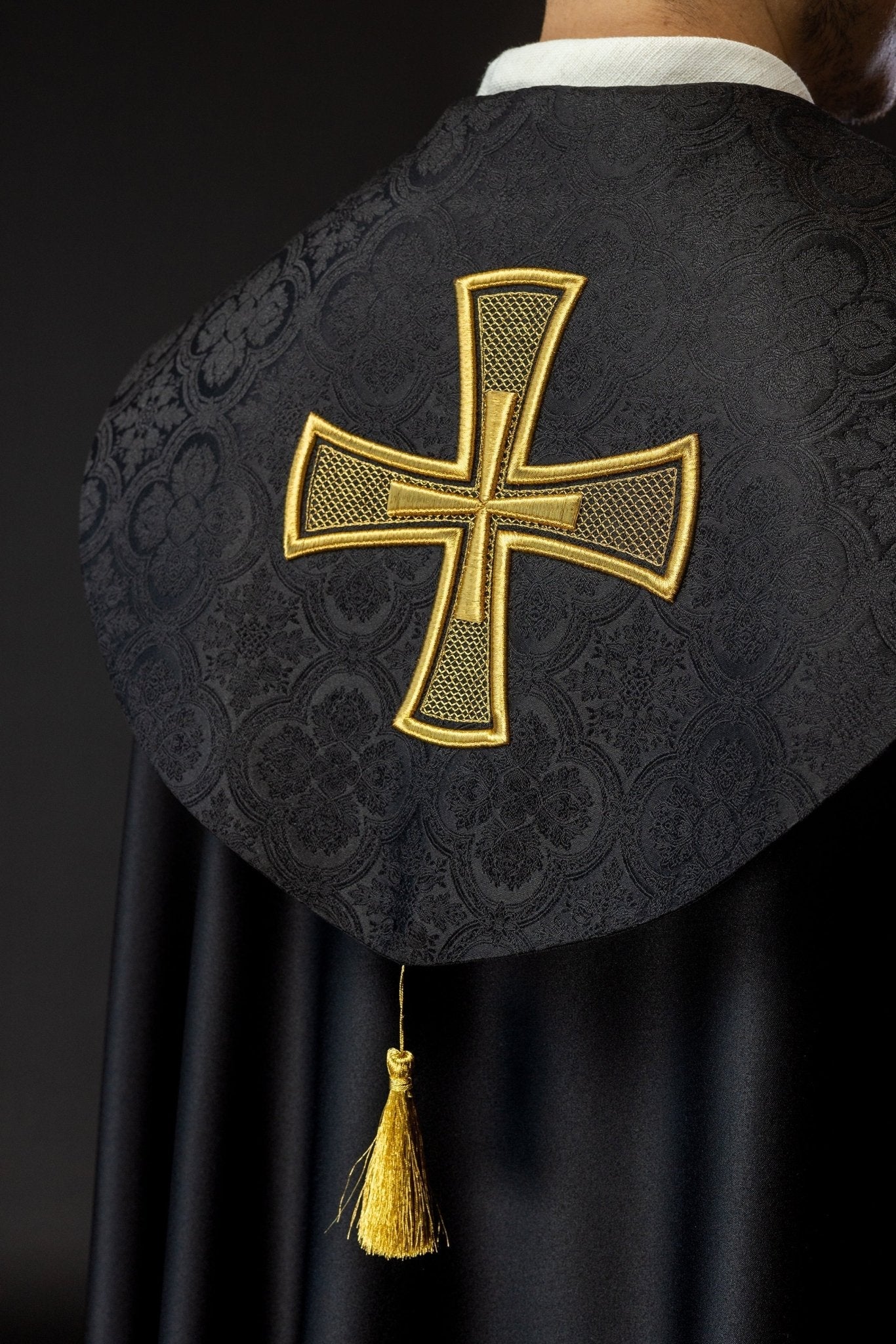 Black cope with gold cross embroidered on jacquard