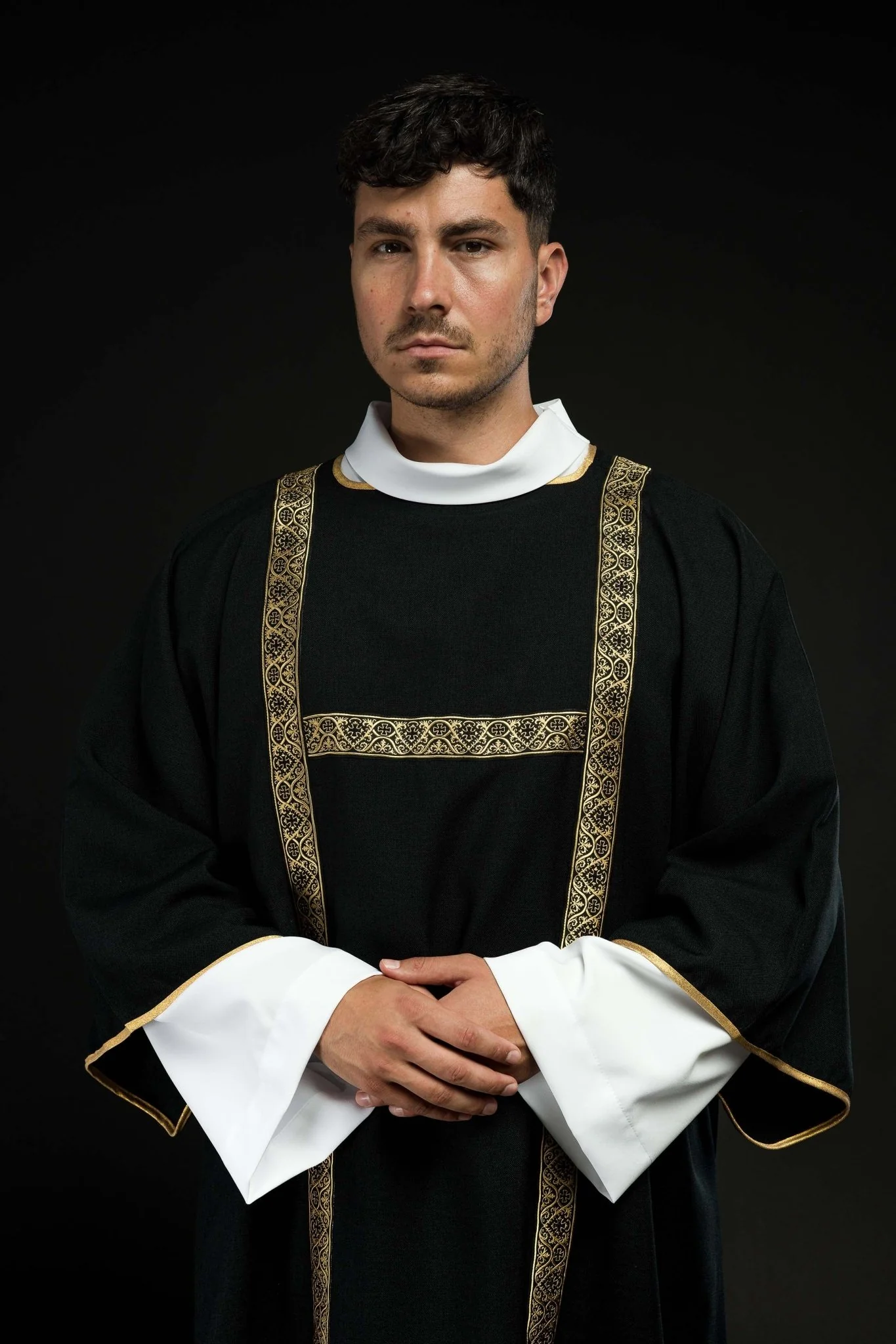 Black dalmatic decorated with gold jacquard ribbons