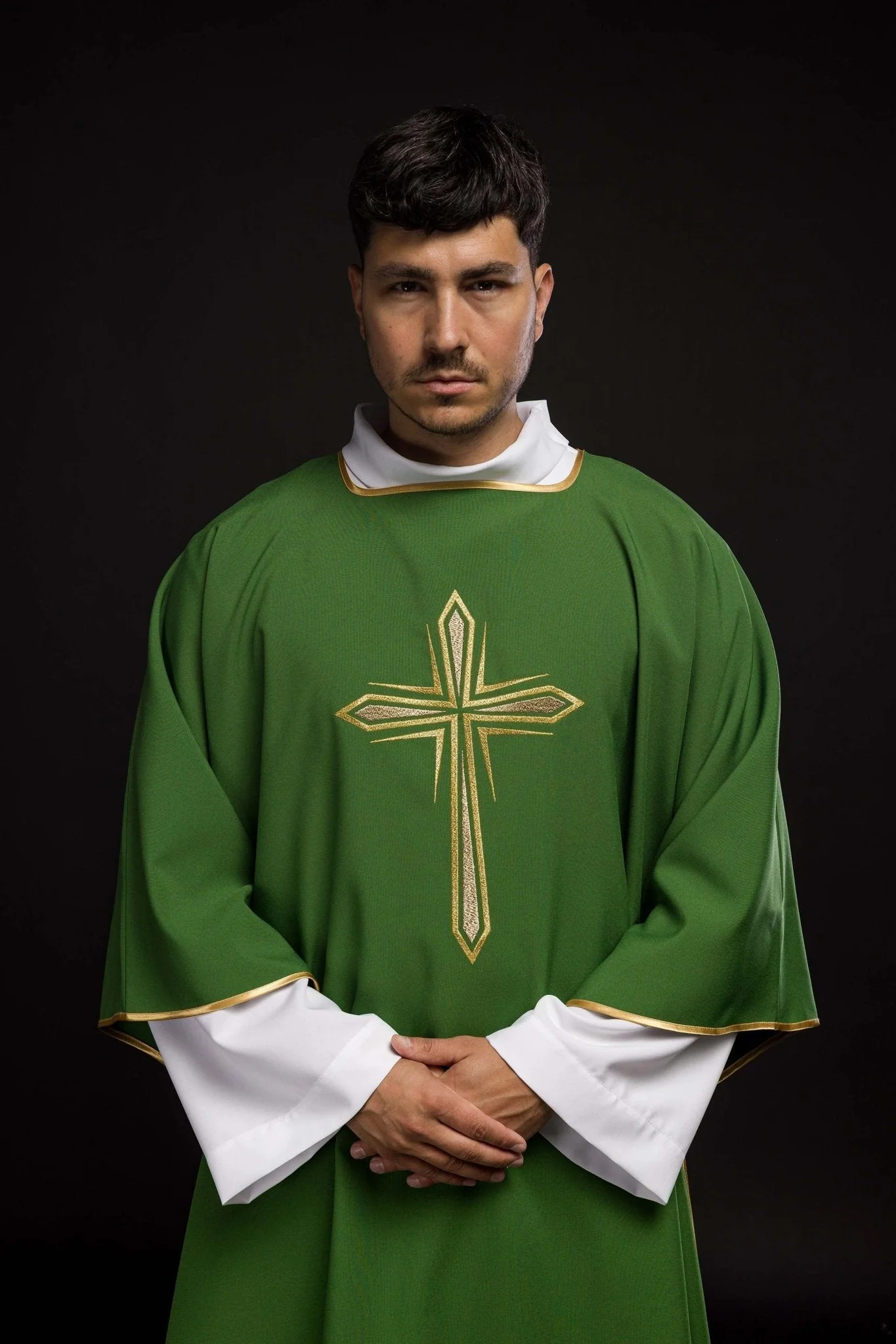 Green dalmatic with an embroidered golden cross