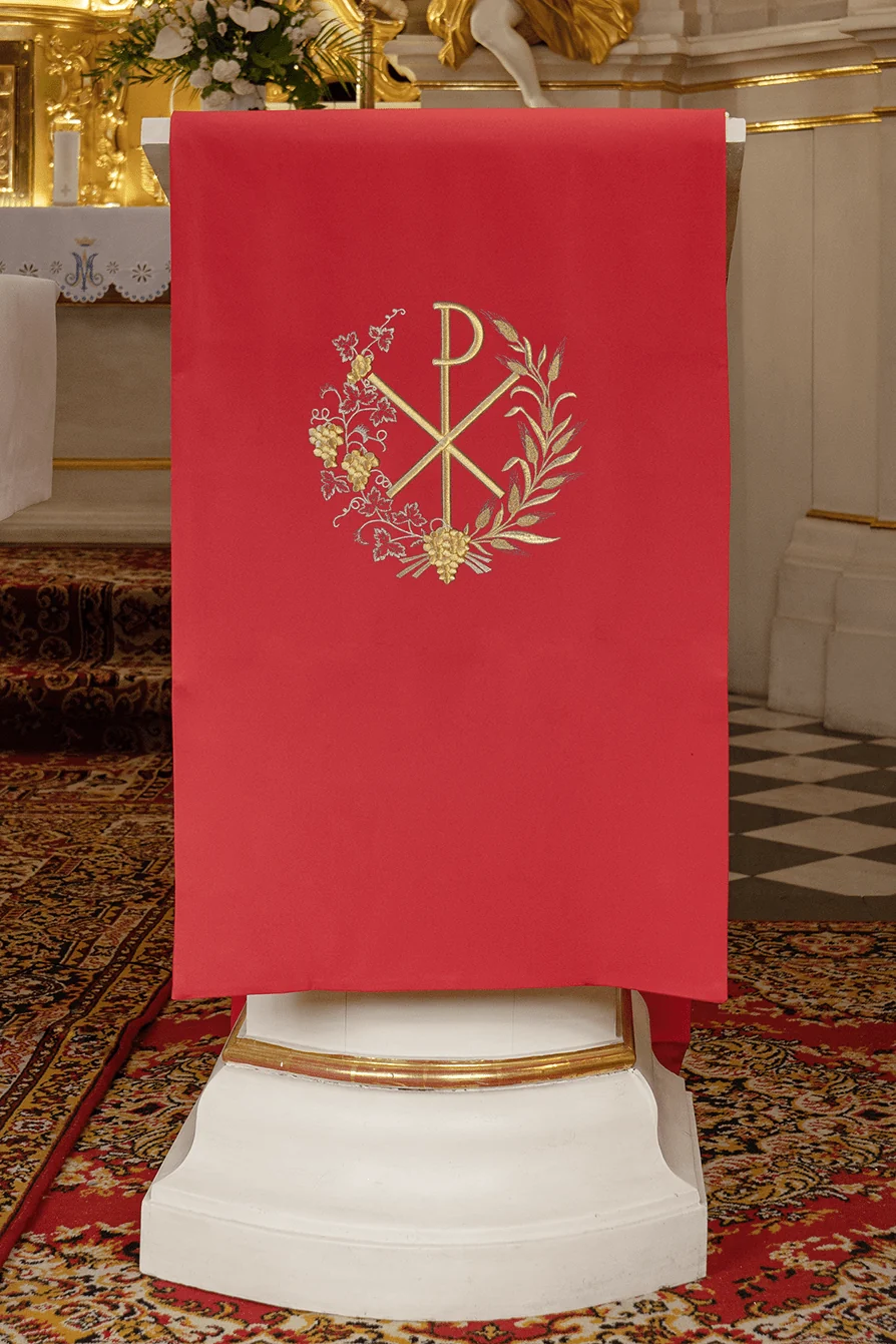 Red lectern cover embroidered with a PAX motif