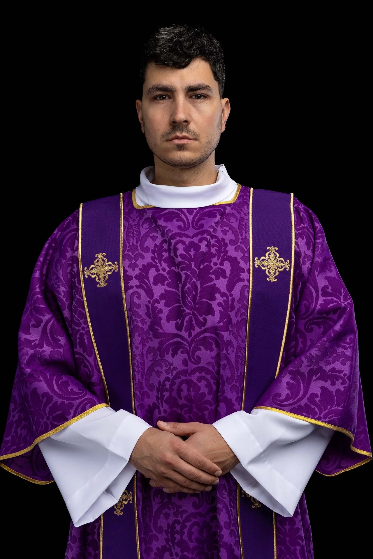 Purple dalmatic in jacquard with bands and embroidered gold crosses
