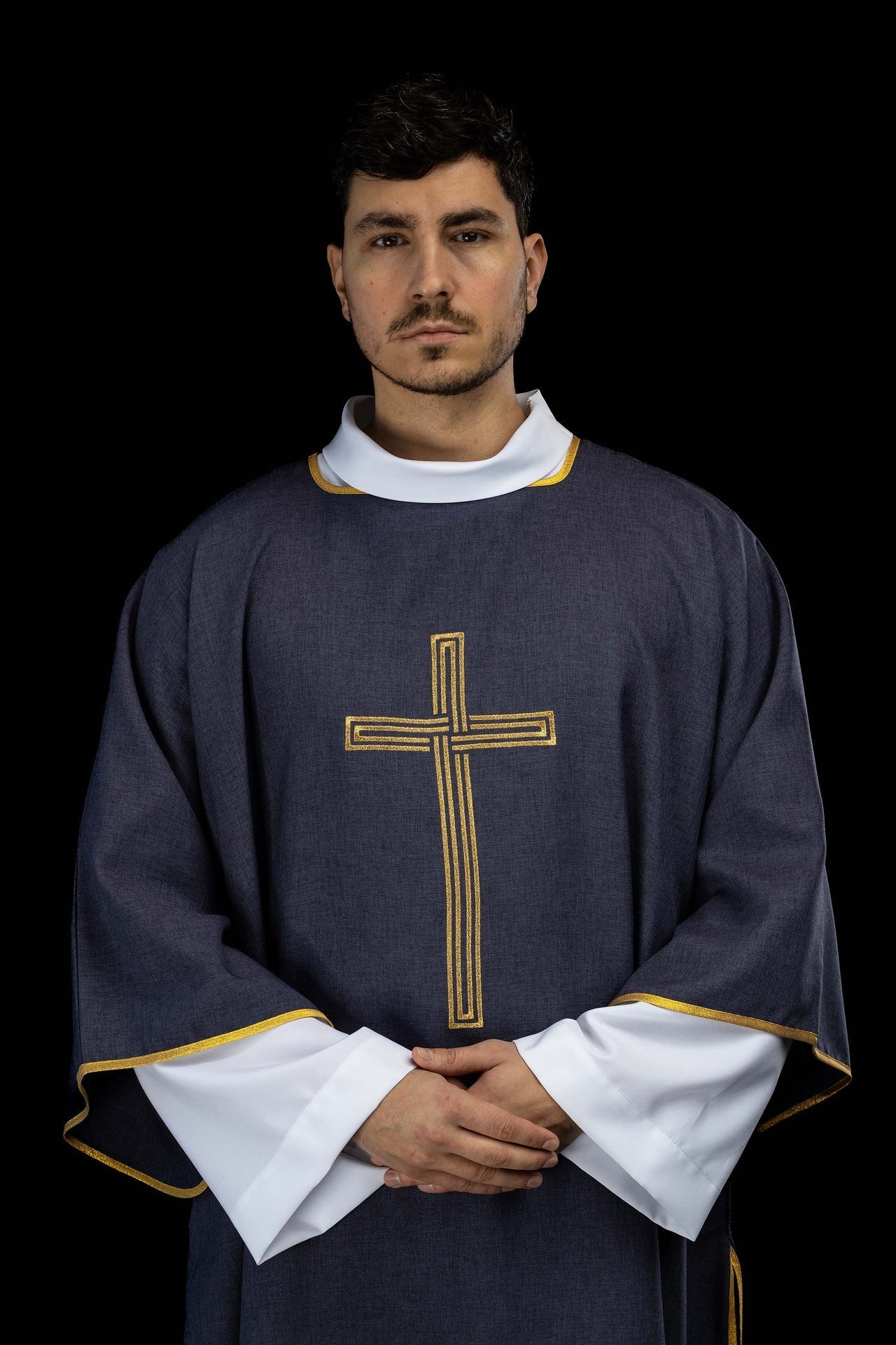 Purple dalmatic with an embroidered gold cross
