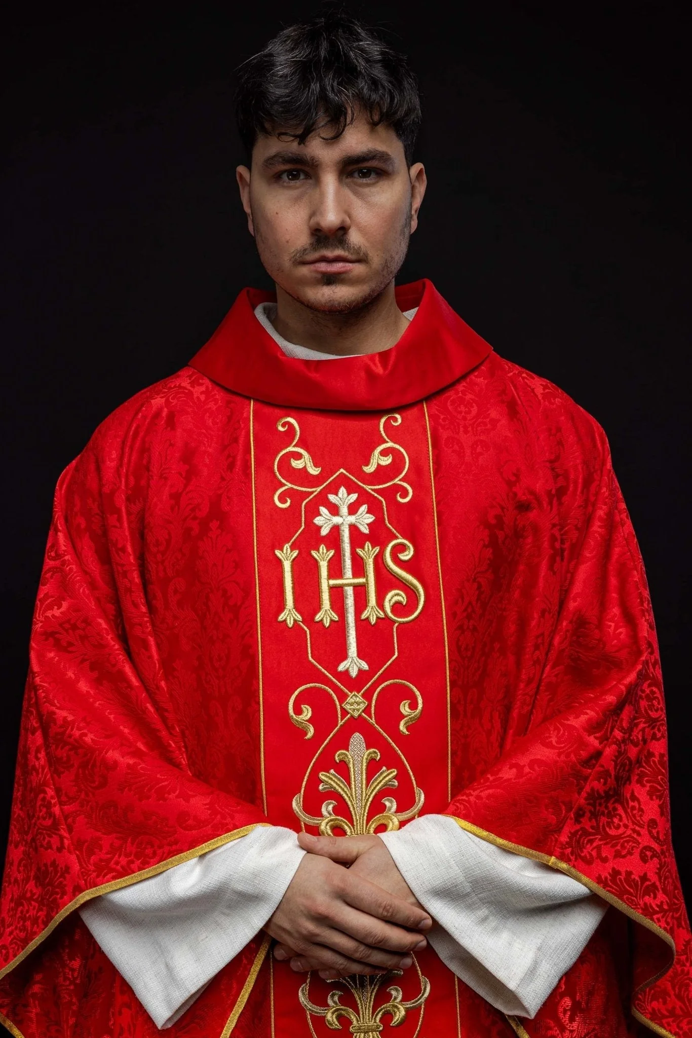 Richly embroidered red IHS chasuble
